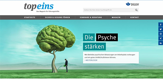 Die Webseite der Unfallkasse NRW zeigt auf der Startseite ein großes grünes Gehirn in einer Landschaft, neben dem ein Mann steht. Im Vordergrund befinden sich die Worte 'Die Psyche stärken.' Die Seite behandelt Themen zur Prävention und Bewältigung psychischer Belastungen am Arbeitsplatz und bietet verschiedene Bereiche wie Startseite, Sicher & Gesund, Suche, Magazin und Kontakt. Oben rechts ist das Logo der Deutschen Gesetzlichen Unfallversicherung (DGUV) zu sehen.