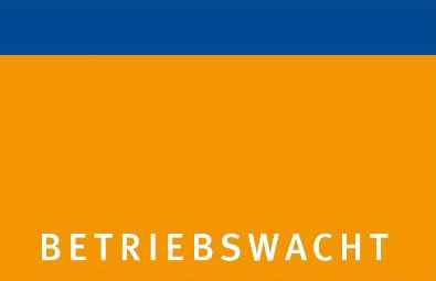 Das Bild zeigt ein rechteckiges Logo, das aus zwei horizontal ausgerichteten Farbblöcken besteht. Der obere Block ist dunkelblau, der untere orange. Am unteren Rand des orangen Blocks steht in weißen, Großbuchstaben 'BETRIEBSWACHT'. Das Logo könnte auf Arbeitsschutz und Prävention im Kontext der Unfallkasse NRW hinweisen.